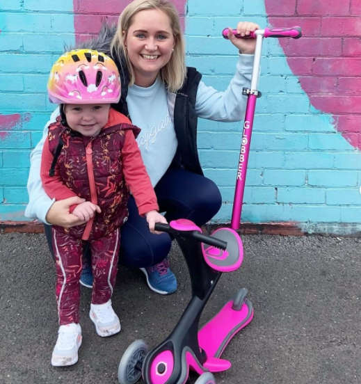 Globber mom with her kid and their GO UP COMFORT scooter with seat for toddlers