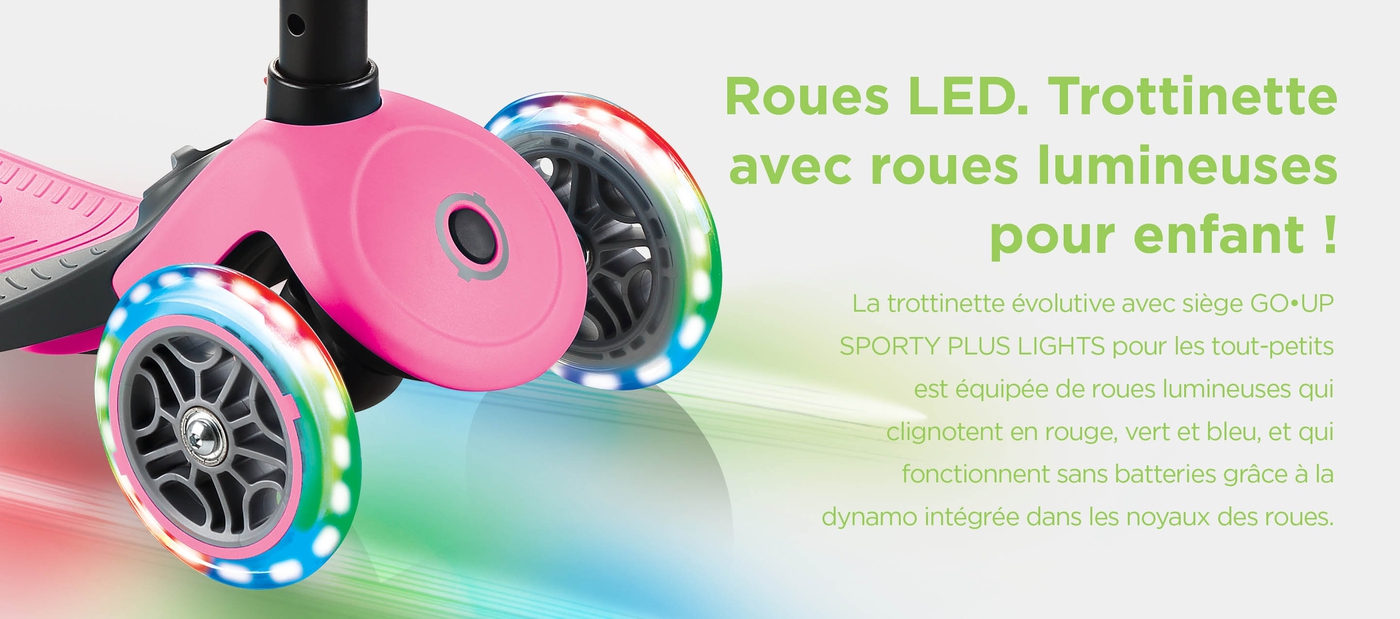 Roues LED. Trottinette avec roues lumineuses pour enfant ! La trottinette évolutive avec siège GO•UP SPORTY PLUS LIGHTS pour les tout-petits est équipée de roues lumineuses qui clignotent en rouge, vert et bleu, et qui fonctionnent sans batteries grâce à la dynamo intégrée dans les noyaux des roues.