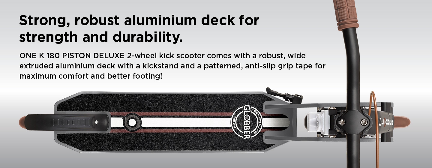 ONE K 180 PISTON DELUXE folding kick scooter for adults comes with a robust, wide extruded aluminium deck with a kickstand